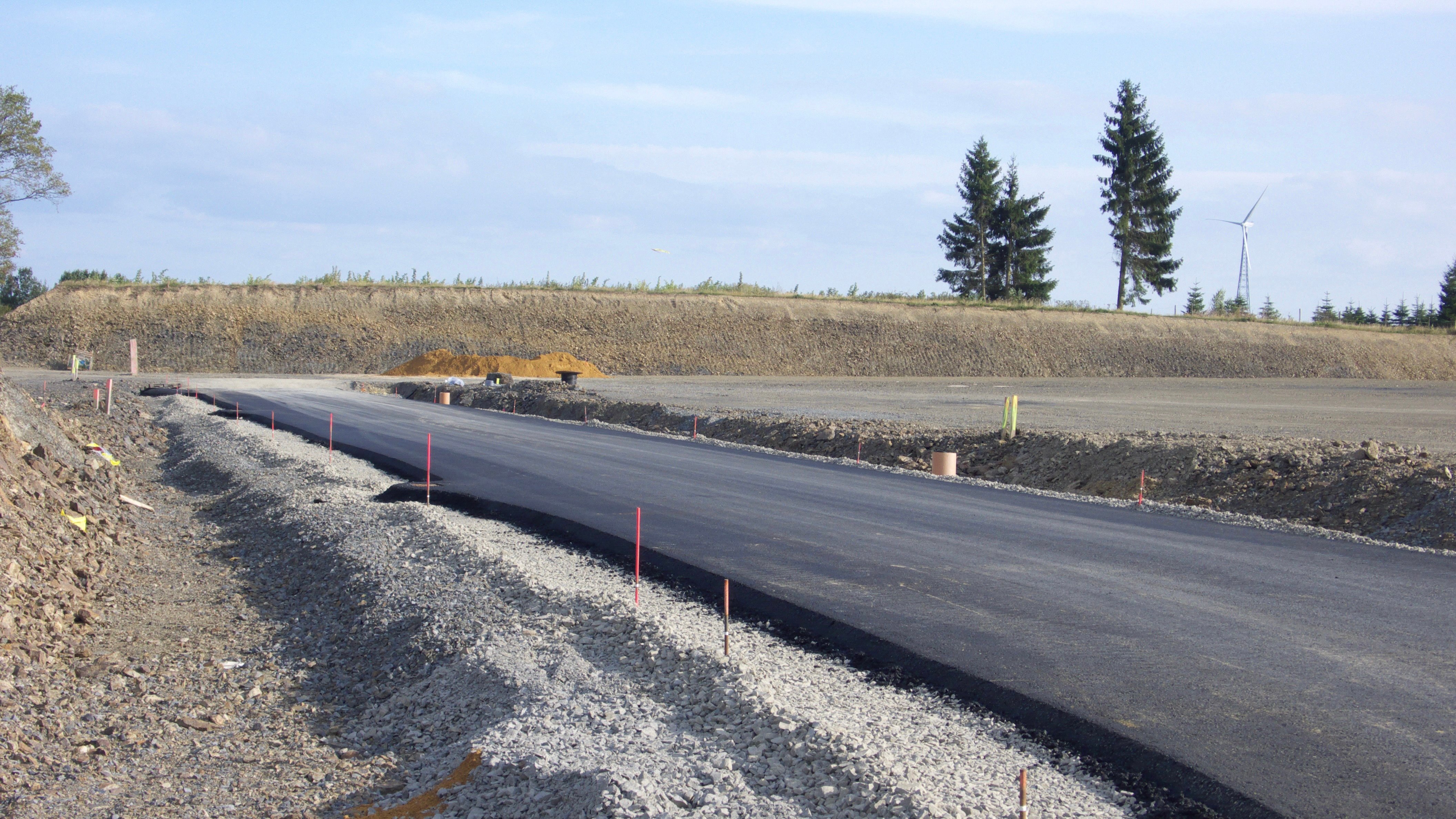 Newly paved municipal road ready for warranty tracking and future contractor inspections