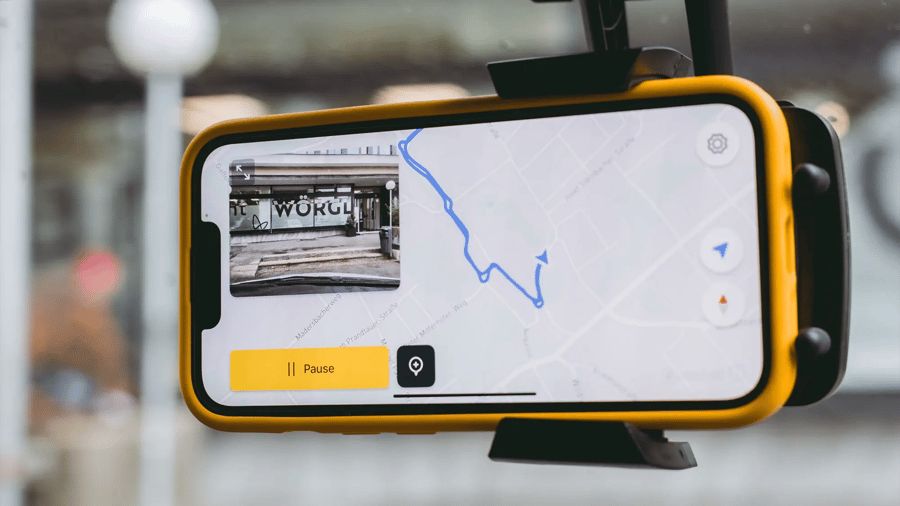 Smartphone running the vialytics app mounted on a vehicle windshield