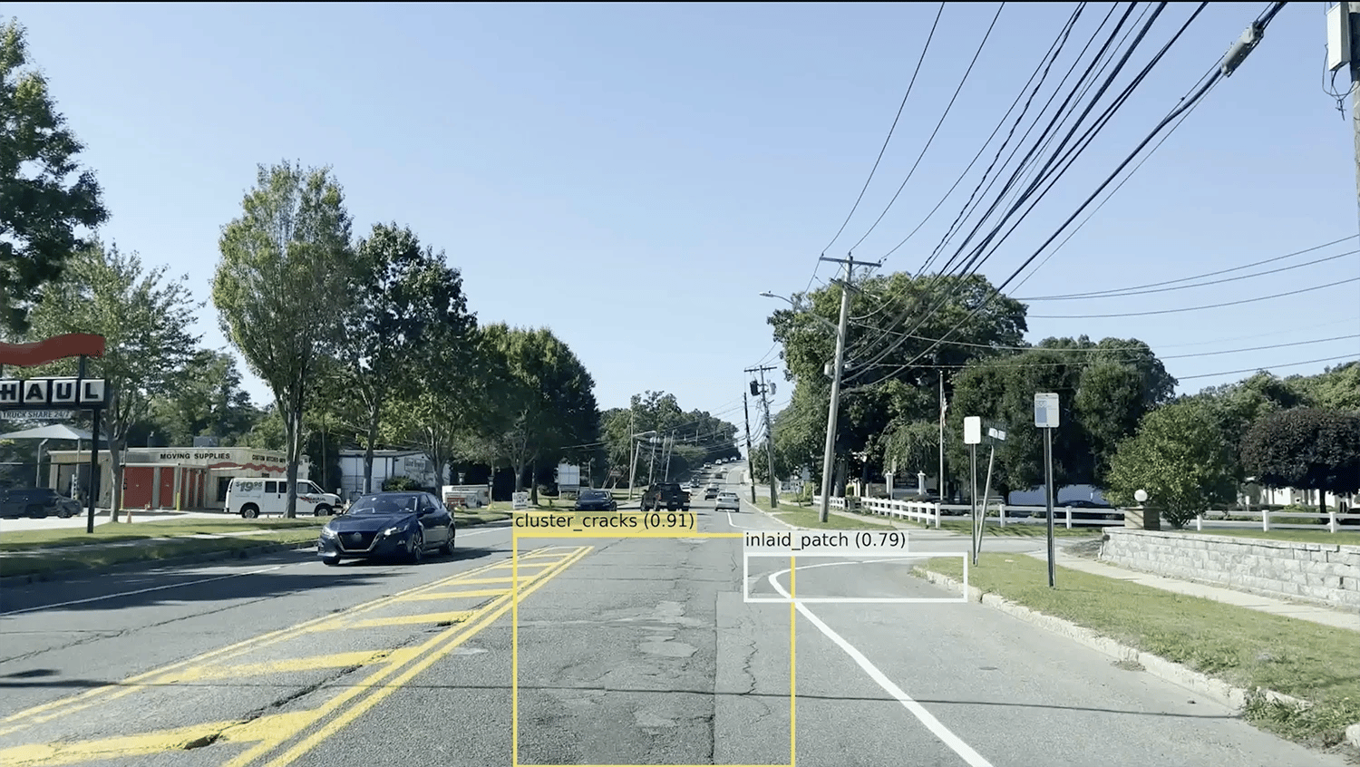 Street-level view of a road through the vialytics interface, featuring AI-powered bounding boxes that automatically detect and rank post-storm infrastructure damage.