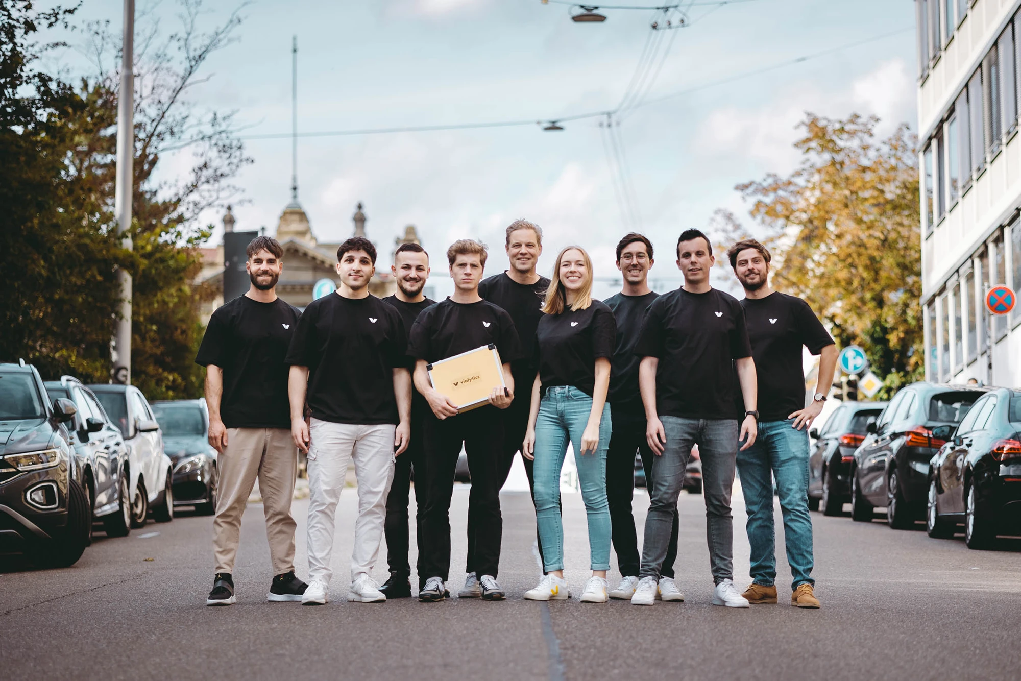 group picture of the vialytics CS team with a hardware package on a road